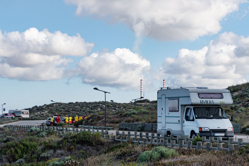 a truck driving down a dirt road