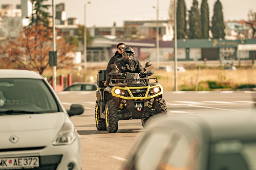 a person riding a motorcycle on a city street